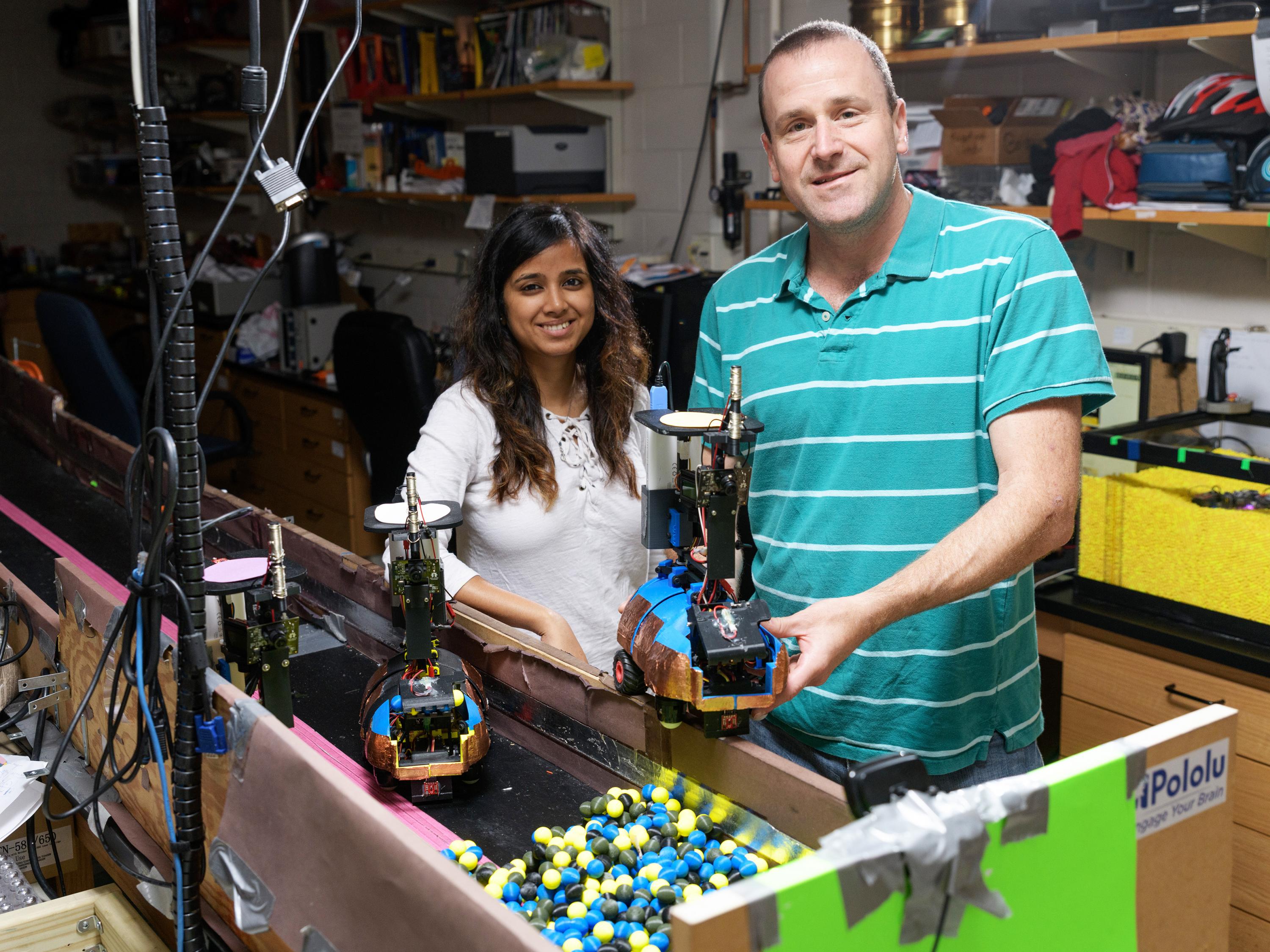Researchers with excavating robots