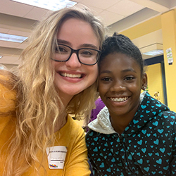 Diana Toro (left) with a student from Scott Elementary School