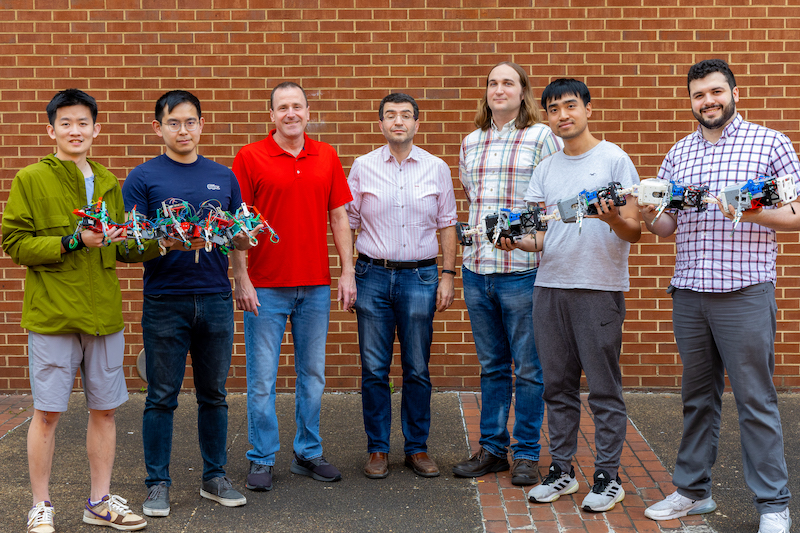 The research team with their robots.