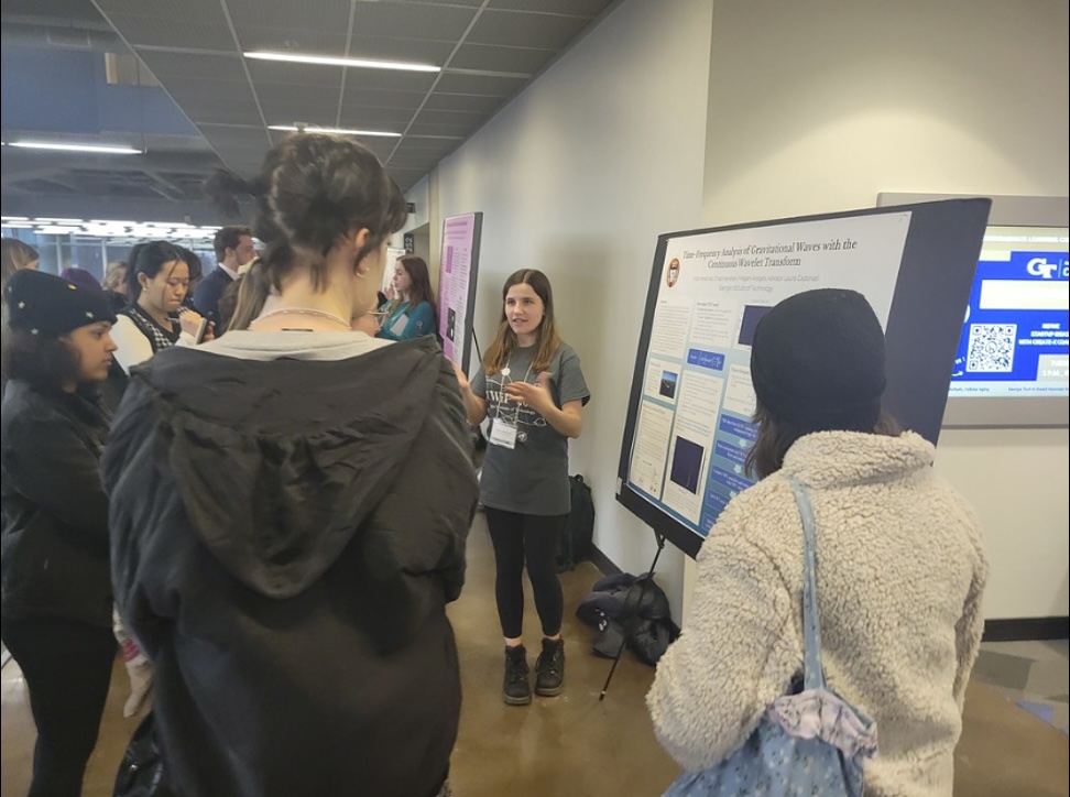 Georgia Tech physics student Alice Heranval presents her poster at CUWiP. Photo: Heather Lee