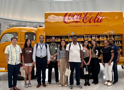 Georgia Tech alumni led behind-the-scenes tours at Coca-Cola’s Atlanta headquarters. As part of their tour, students checked out an original 1949 yellow delivery truck parked in the rotunda of Coke’s Central Reception Building.