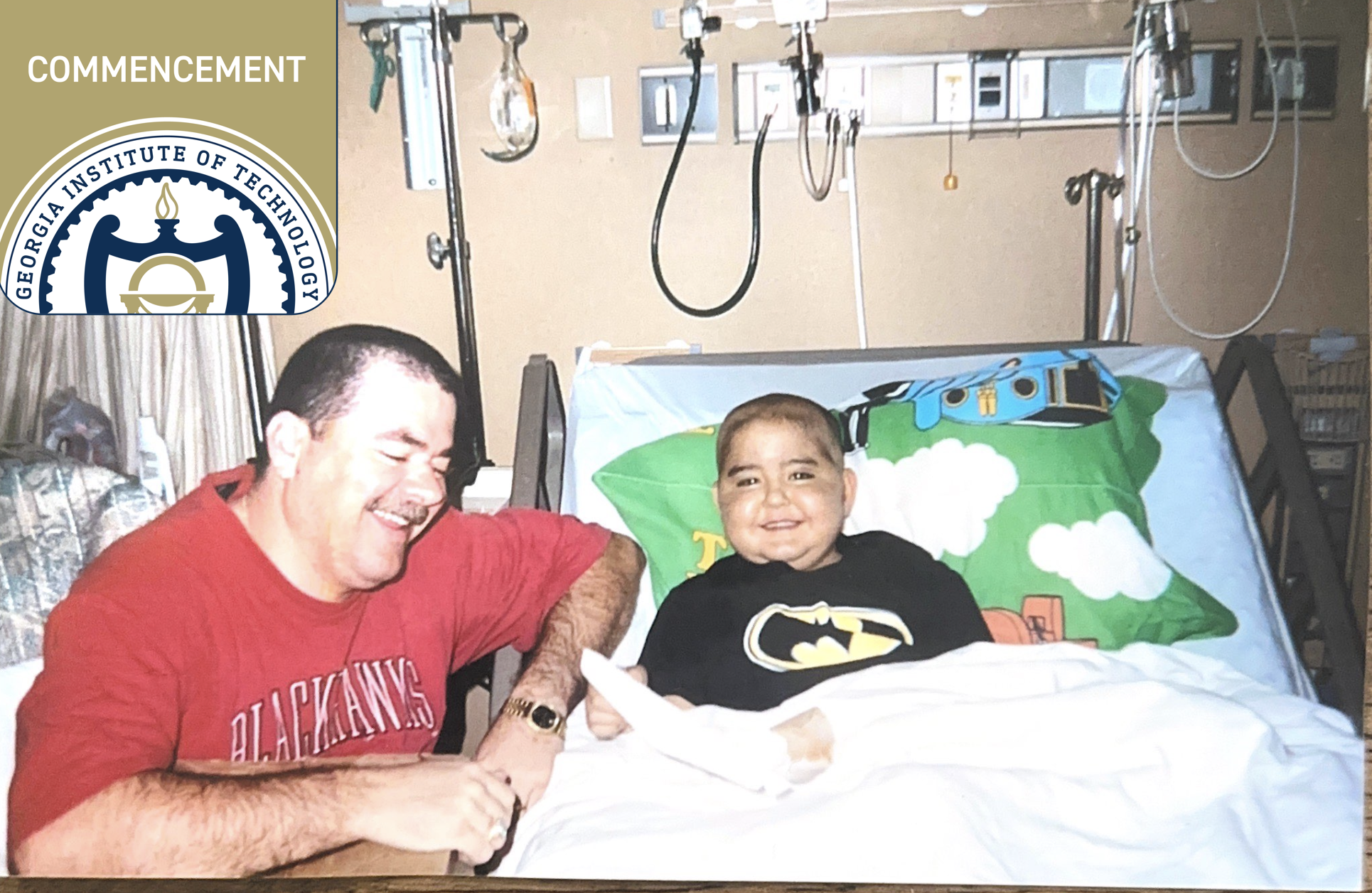 Andrew Rogers in the hospital with his dad by his side. 