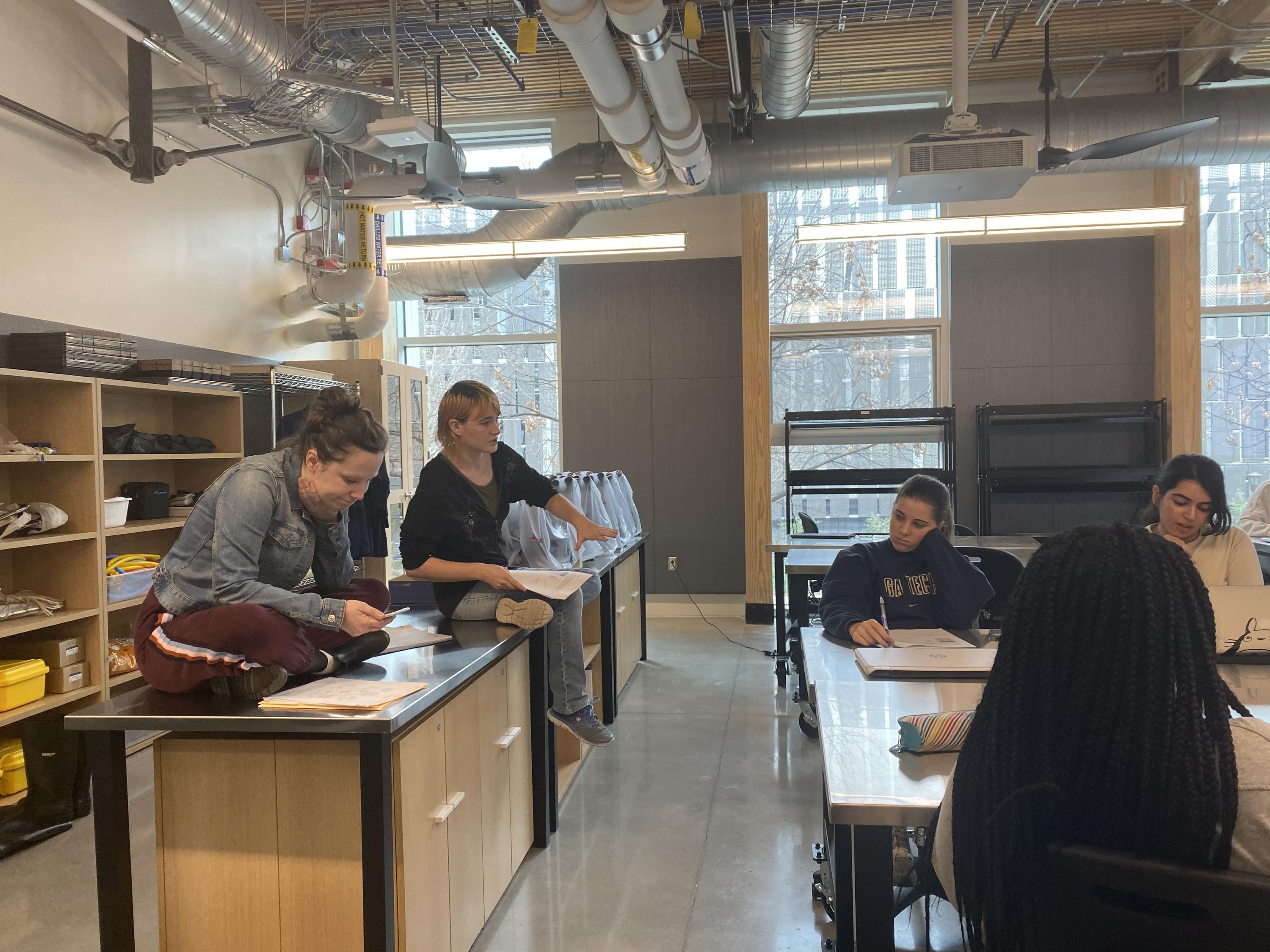 Drake Lee-Patterson (left) and Stephanie Bilodeau, co-instructors, review an assignment with students. (Photo: Grace Pietkiewicz)