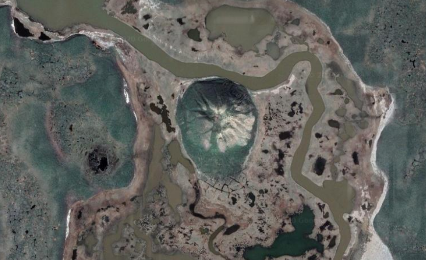 Ibyuk Pingo in Canada, as seen from directly above. Mars, Ceres, and the Earth have abundant reserves of ground ice. On Earth, ice-cored mounds known as pingos are important indicators of groundwater systems and local climate. Credit: Google Earth