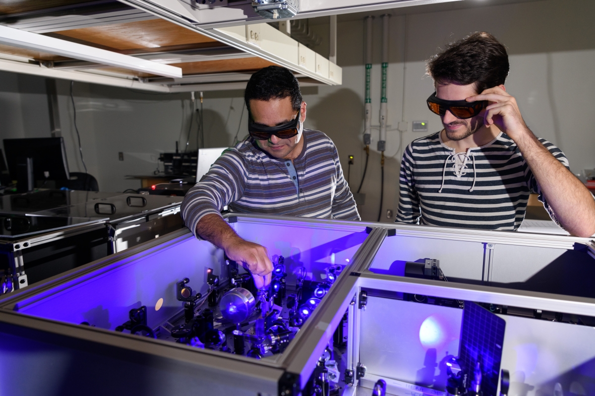 Carlos Silva (left) and graduate assistant Felix Thouin in the Silva Research Group lab.