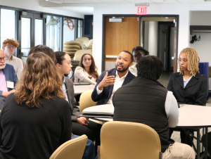 Austin Hope (PSY 2014), a people partner at Google, chats with students and alumni during the Students and Alumni Leadership Dinner. Austin Hope (PSY 2014), a people partner at Google, chats with students and alumni during the Students and Alumni Leadership Dinner.