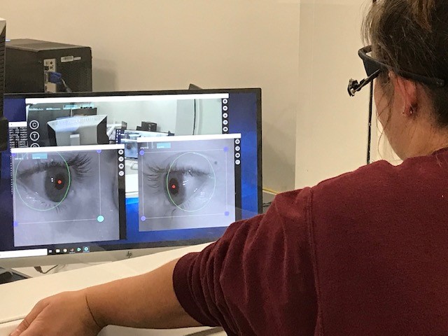 3rd year student Kristina Giddens tests eye tracking (Photo by Renay San Miguel.)